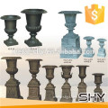 antique flowerpots in cast iron material for garden decoration